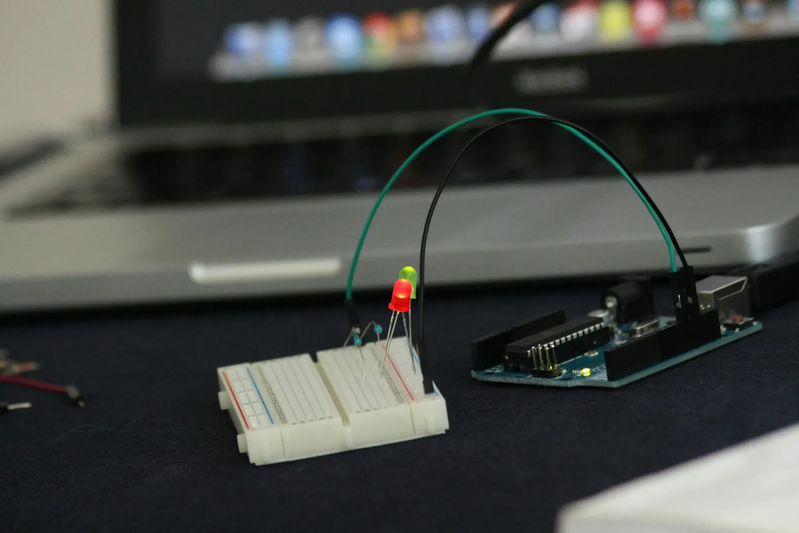 bread board with arduino and laptop in background