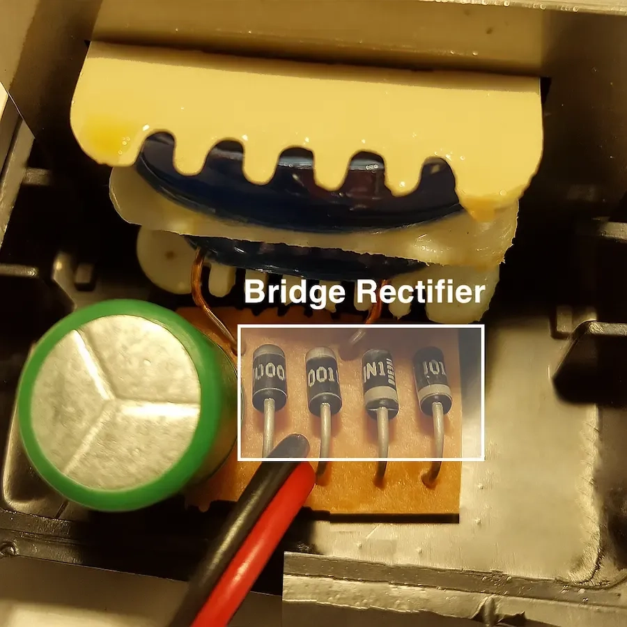 crack-opened-traditiona-ac-to-dc-adapter-with-diodes-highlighted